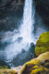 Haifoss waterfall in south iceland. water is crashing against the rocks on the bottom