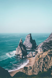 Aerial view from a sandy wild beach with amazing rocks. ursa beac