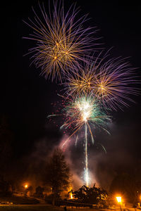 Low angle view of firework display at night