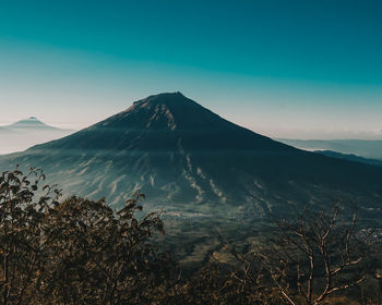 Scenic view of volcanic mountain against sky