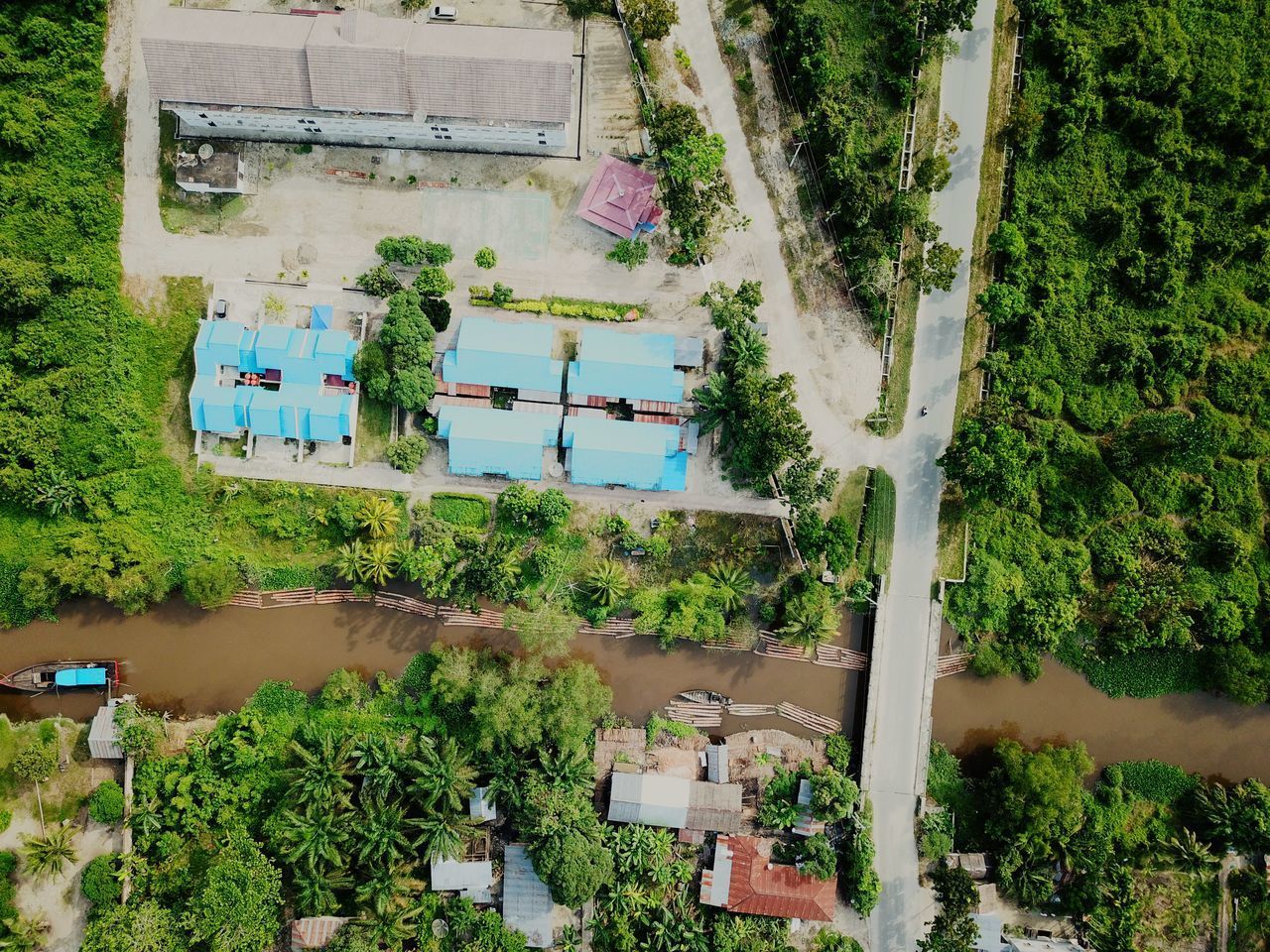 HIGH ANGLE VIEW OF TREES AND HOUSE IN VILLAGE