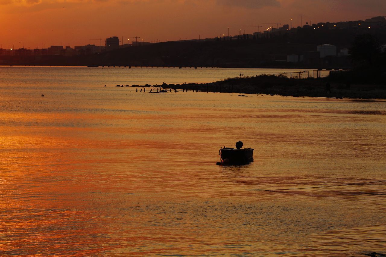 water, sunset, sky, nautical vessel, waterfront, beauty in nature, sea, transportation, silhouette, scenics - nature, nature, mode of transportation, orange color, outdoors, tranquility, tranquil scene, cloud - sky, travel