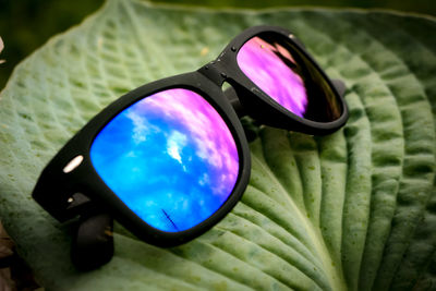 Close-up of sunglasses on glass