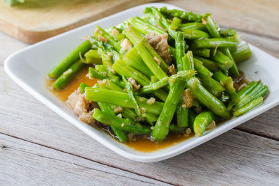 High angle view of chopped vegetables in bowl on table