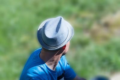 Portrait of man wearing hat on field