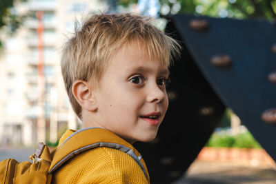 Portrait of a little boy on the playground.