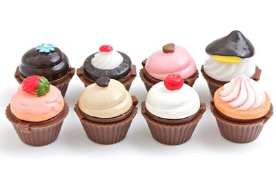 Close-up of cupcakes against white background