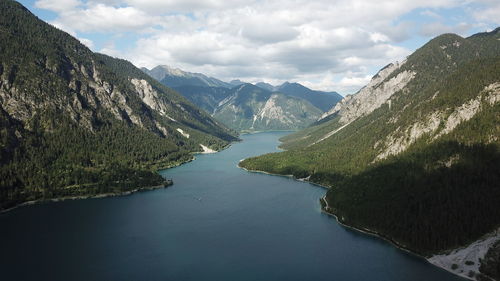 Aerial view of lake by forest