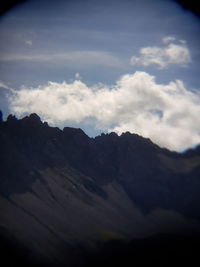 Low angle view of mountain range against sky
