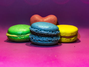 Close-up of multi colored candies on table