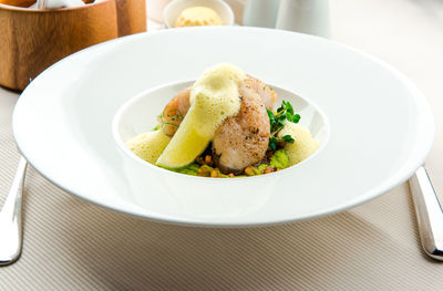 Close-up of food served in plate on table