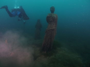 People swimming in sea