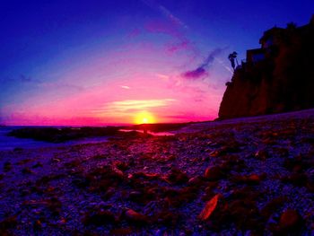 Scenic view of landscape against sky at sunset