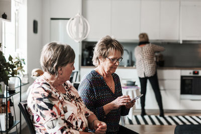 Senior women talking at home