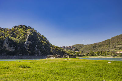 Scenic view of sea against clear blue sky
