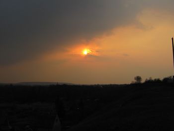 Scenic view of silhouette landscape against sky during sunset