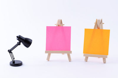Close-up of electric lamps against white background
