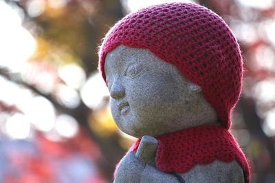 Close-up of female sculpture in park during winter