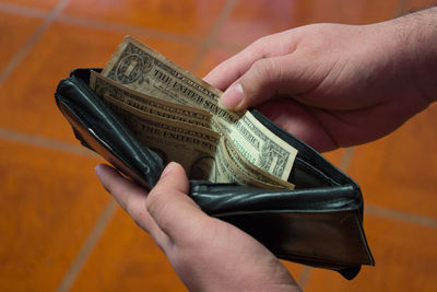 Close-up of hand holding paper