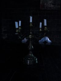 Reflection of illuminated lamp on wall