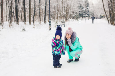 People on snowy field during winter