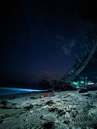 Scenic view of land against sky at night