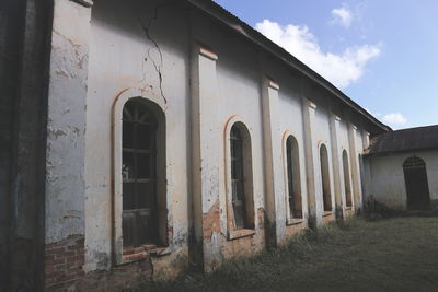 Low angle view of old building against sky