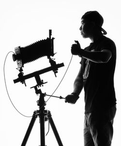 Low angle view of man using mobile phone