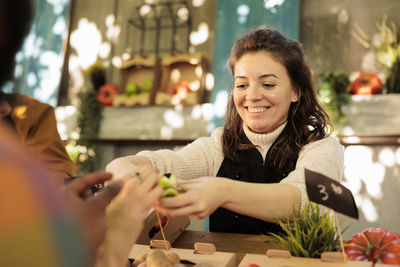 Portrait of young woman using mobile phone