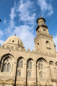 Low angle view of mosque against sky