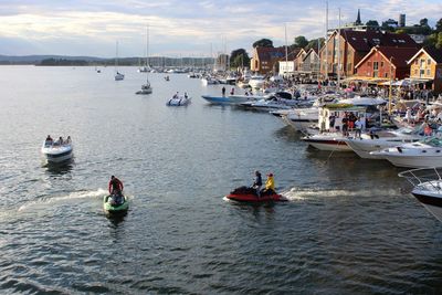 People on river against sky