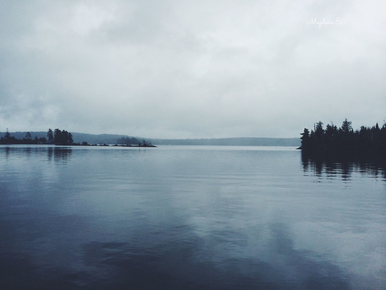 water, sky, tranquil scene, tranquility, sea, waterfront, scenics, beauty in nature, reflection, nature, cloud - sky, lake, idyllic, weather, dusk, calm, cloudy, horizon over water, outdoors, beach