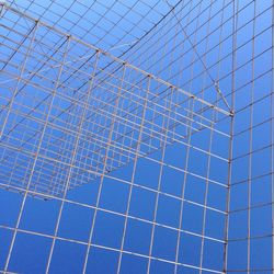 Full frame shot of modern building against blue sky