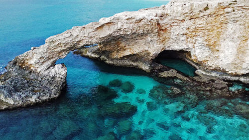 High angle view of rock formation in sea