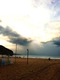 Scenic view of beach against sky during sunset