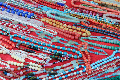 Full frame shot of multi colored necklace at market for sale