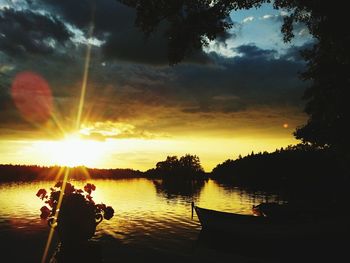 Scenic view of lake at sunset