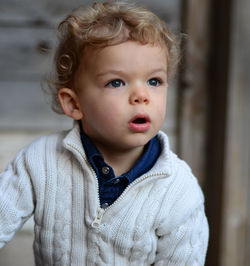 Portrait of cute boy looking away