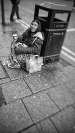 Boy sitting outdoors