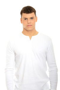 Portrait of young man standing against white background