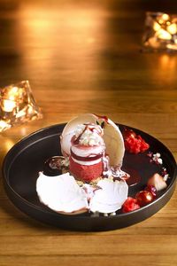 Ice cream in plate on table