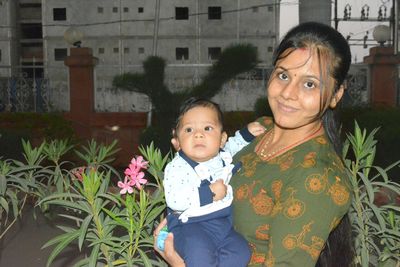 Portrait of happy mother and daughter outdoors