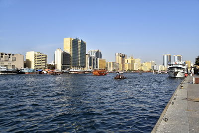 Dubai skyline from dubai creek harbour and dubai canal to downtown and business bay, uae