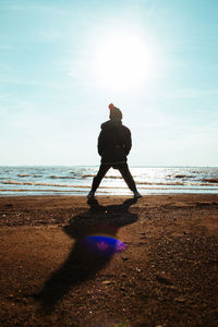 Boy contemplating the sea