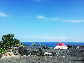 Scenic view of sea against blue sky