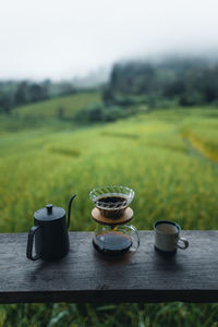 View of tea on table in field