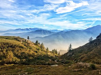 Scenic view of landscape and mountains against sky