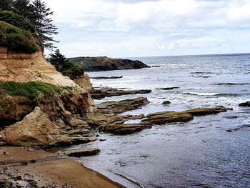 Scenic view of sea against cloudy sky