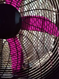 Low angle view of illuminated glass ceiling