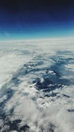 Aerial view of landscape against blue sky